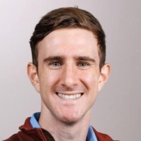 Abraham Post smiling in a professional portrait